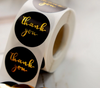 Label Negro de 1.5" redondo con foil dorado.